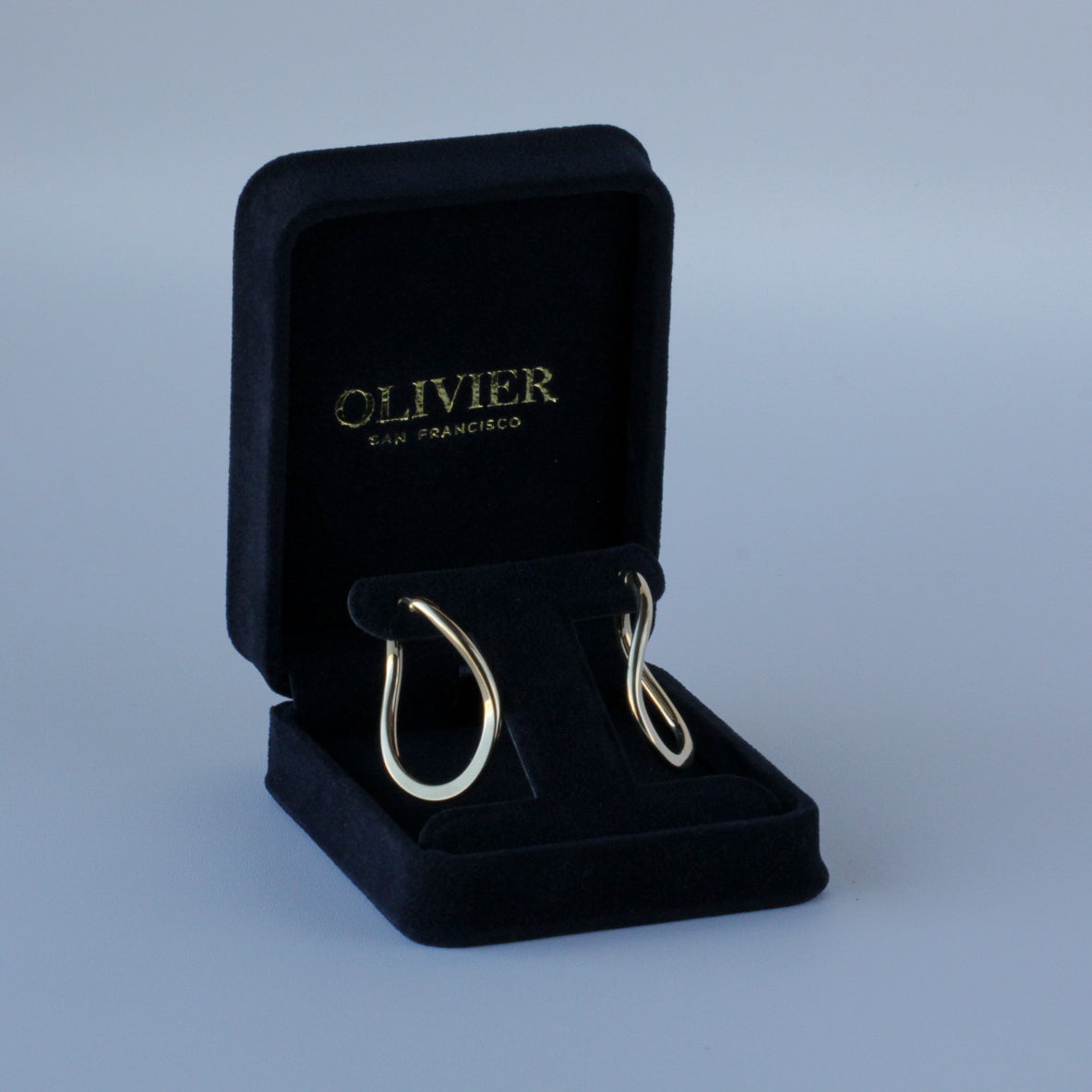 Gold earrings in jewelry box