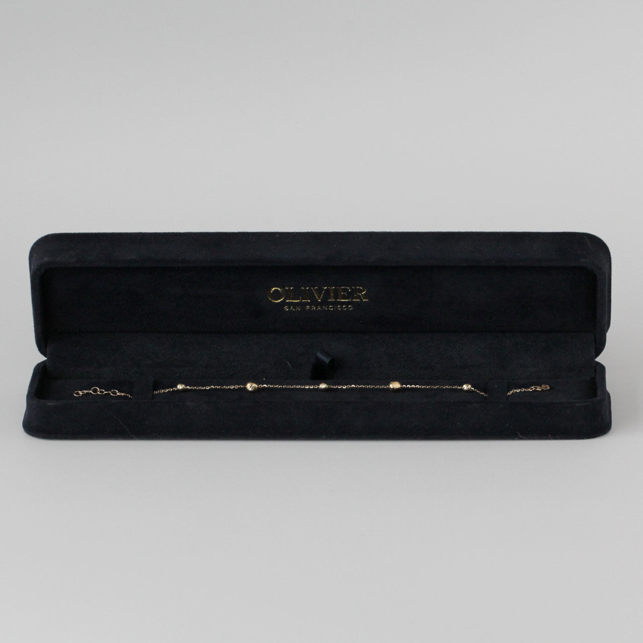 gold bead bracelet in box