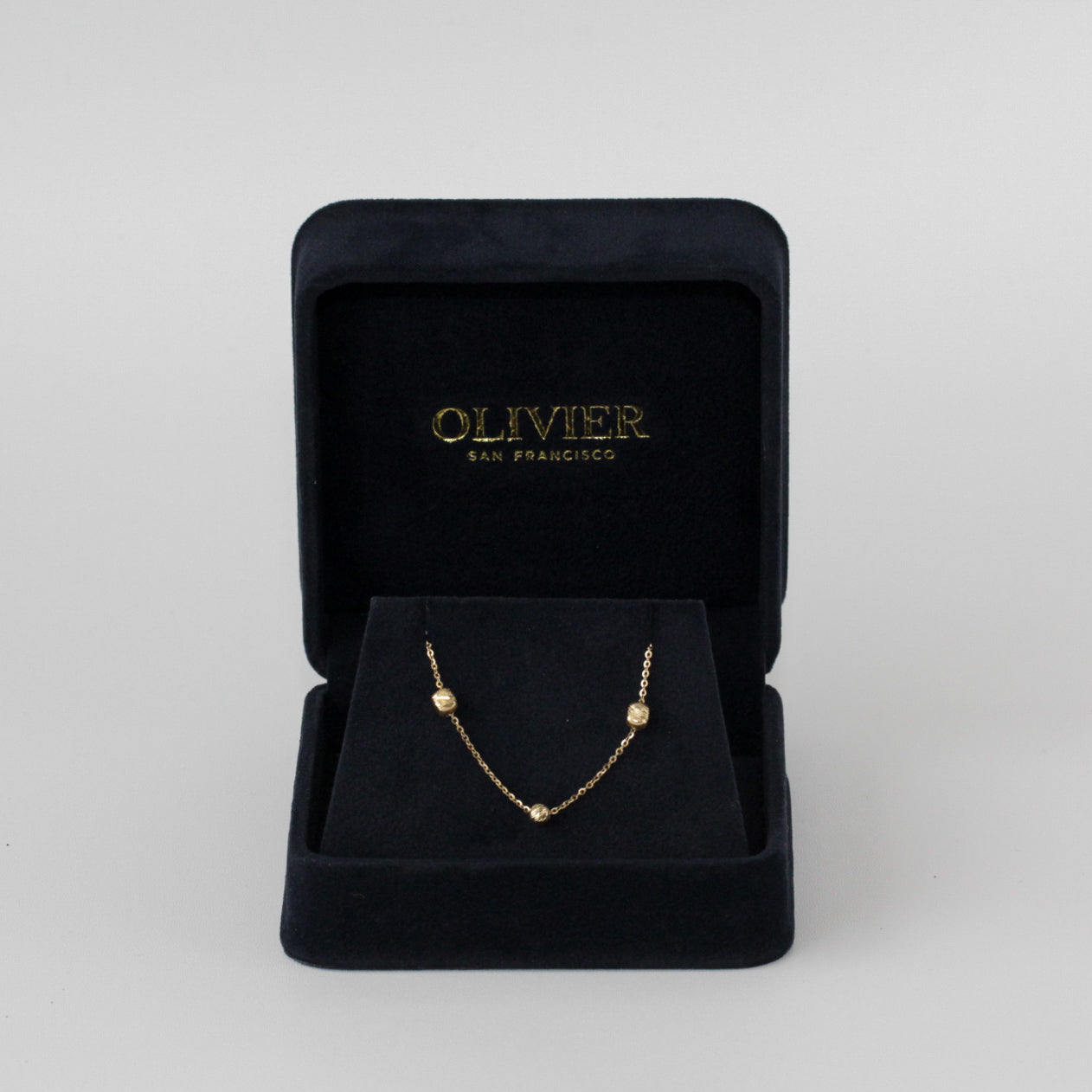 gold bead necklace in box
