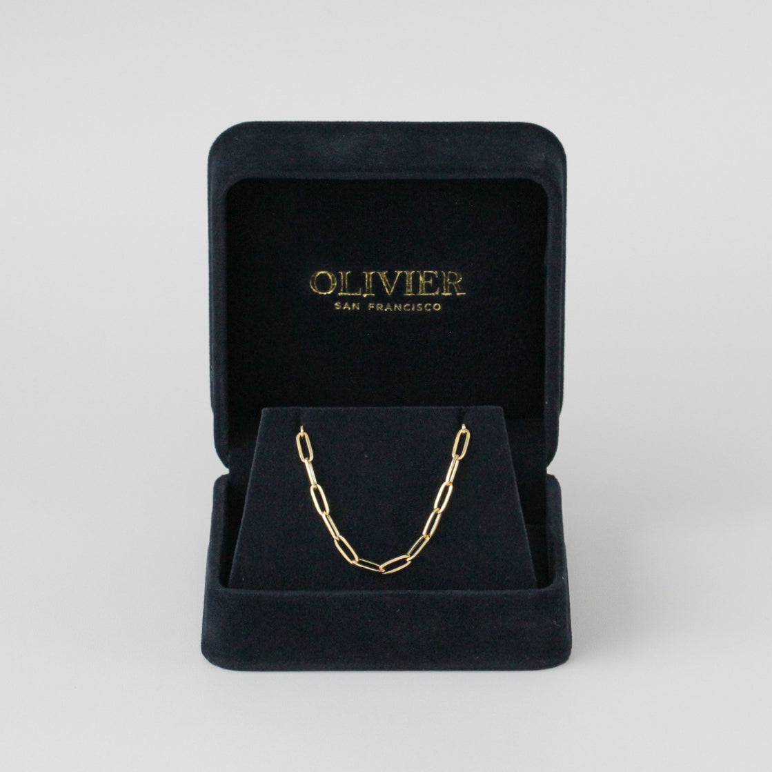 Gold link paper clip in box