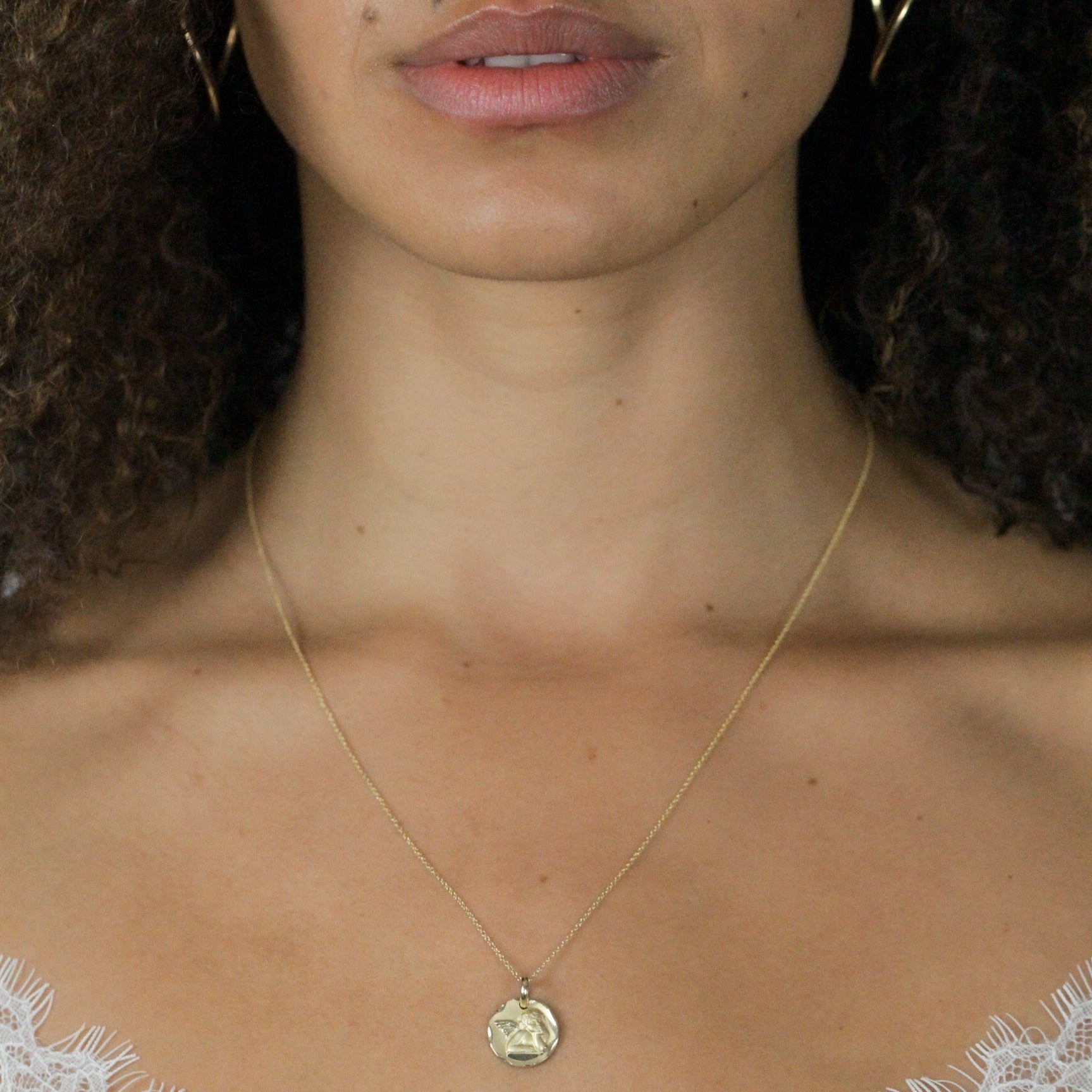 Gold Pendant cherub on model