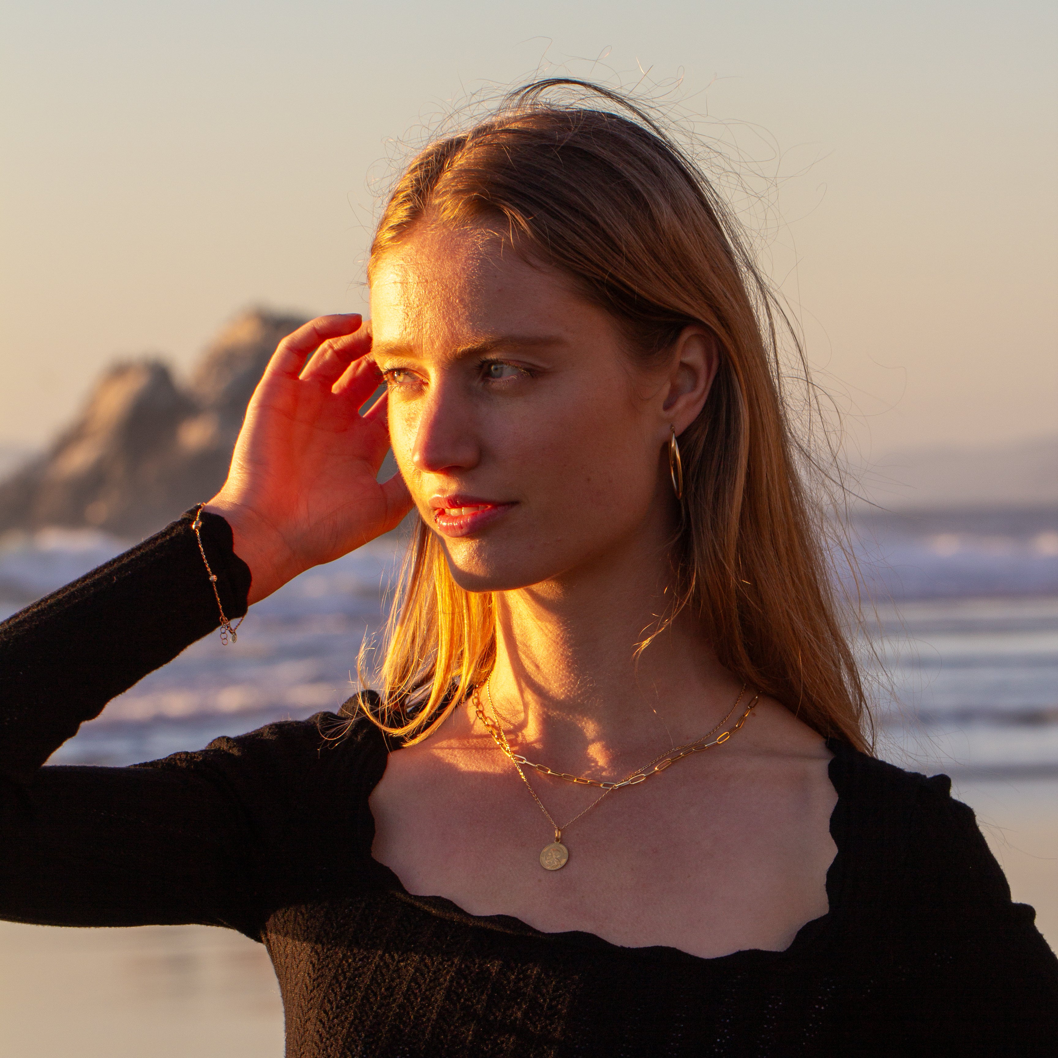 Gold link paper clip chain women stacked at beach