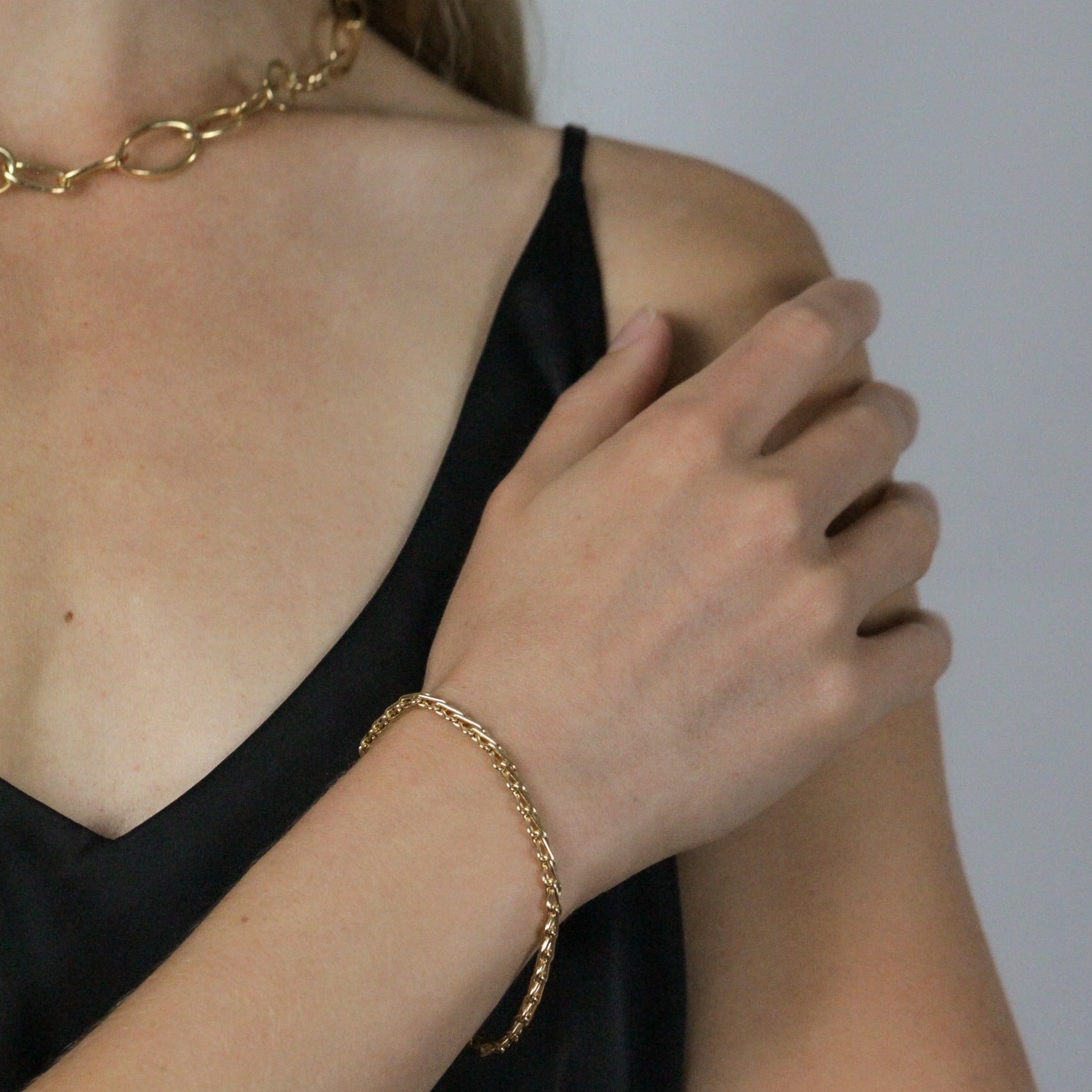 Bold gold bracelet on model, made in italy