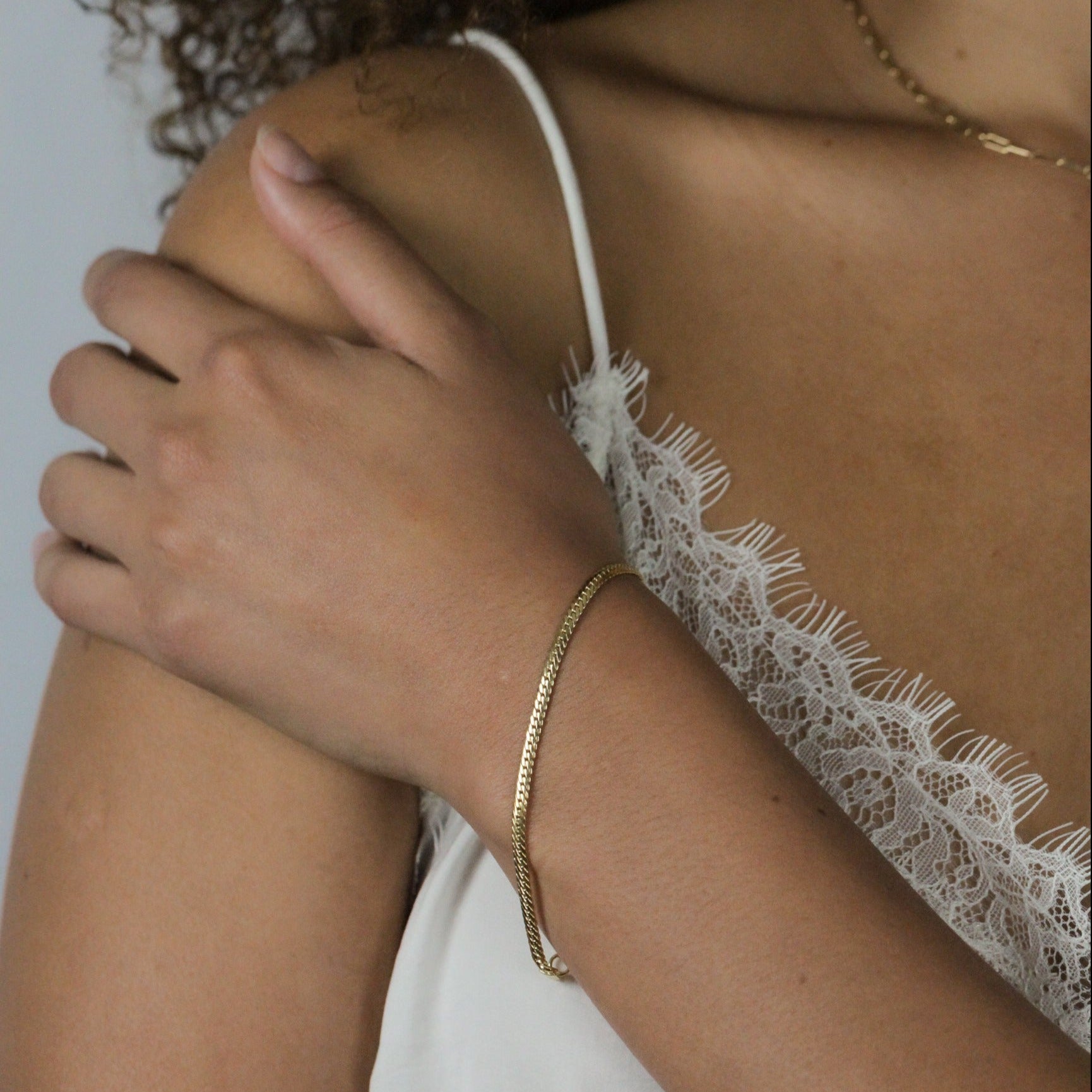 fine gold bracelet on hand, made in italy