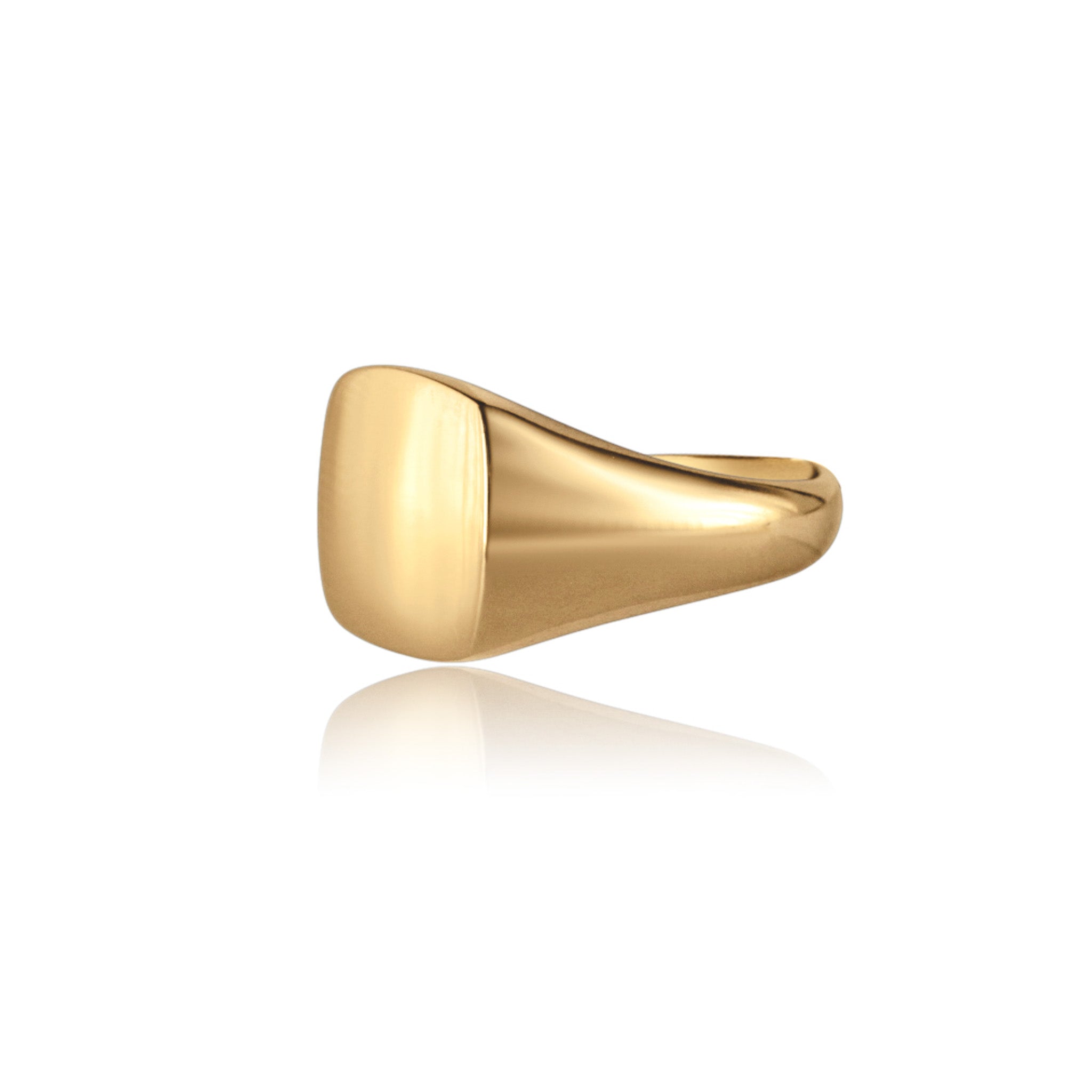 Gold pinky ring on white background