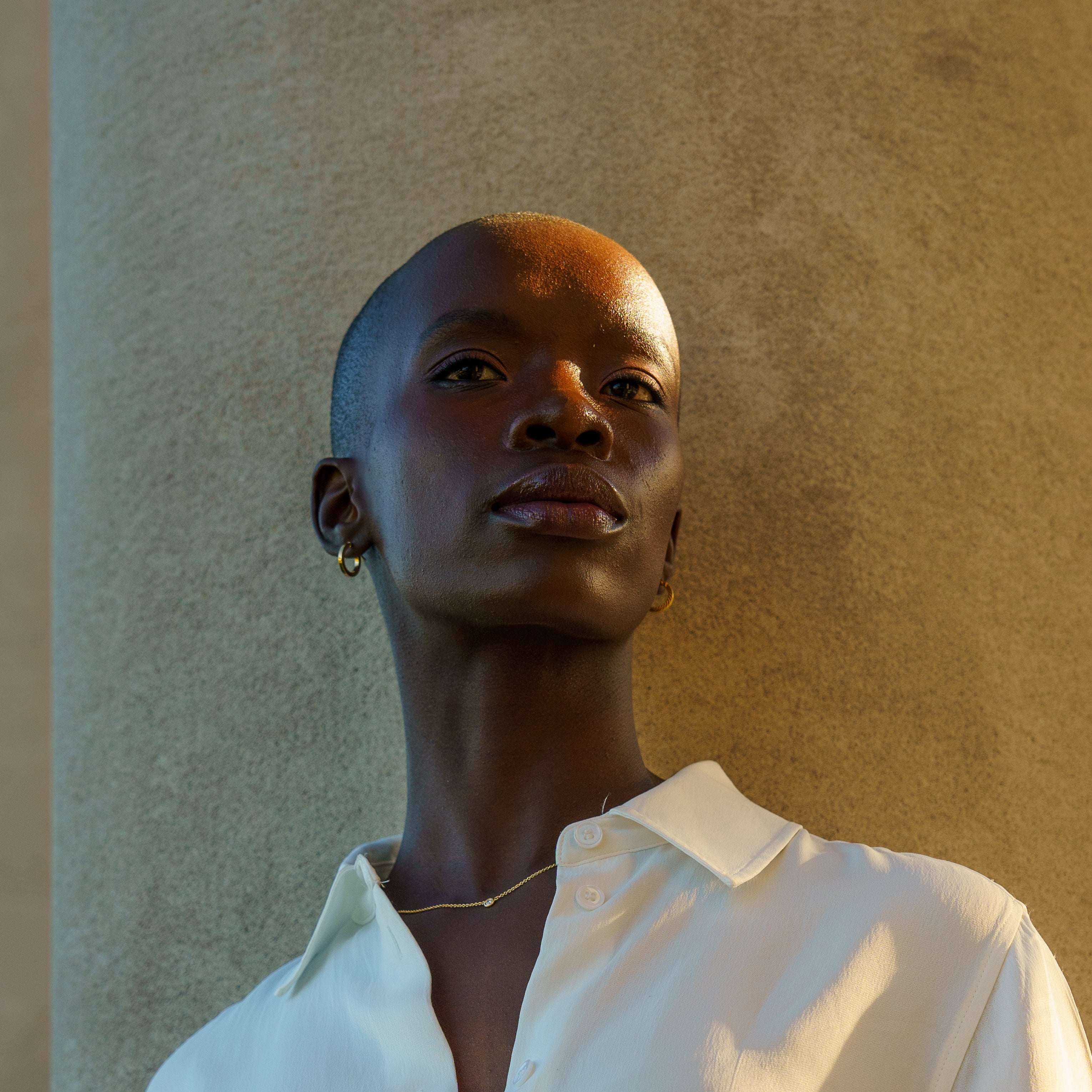Classic gold hoops earrings on model