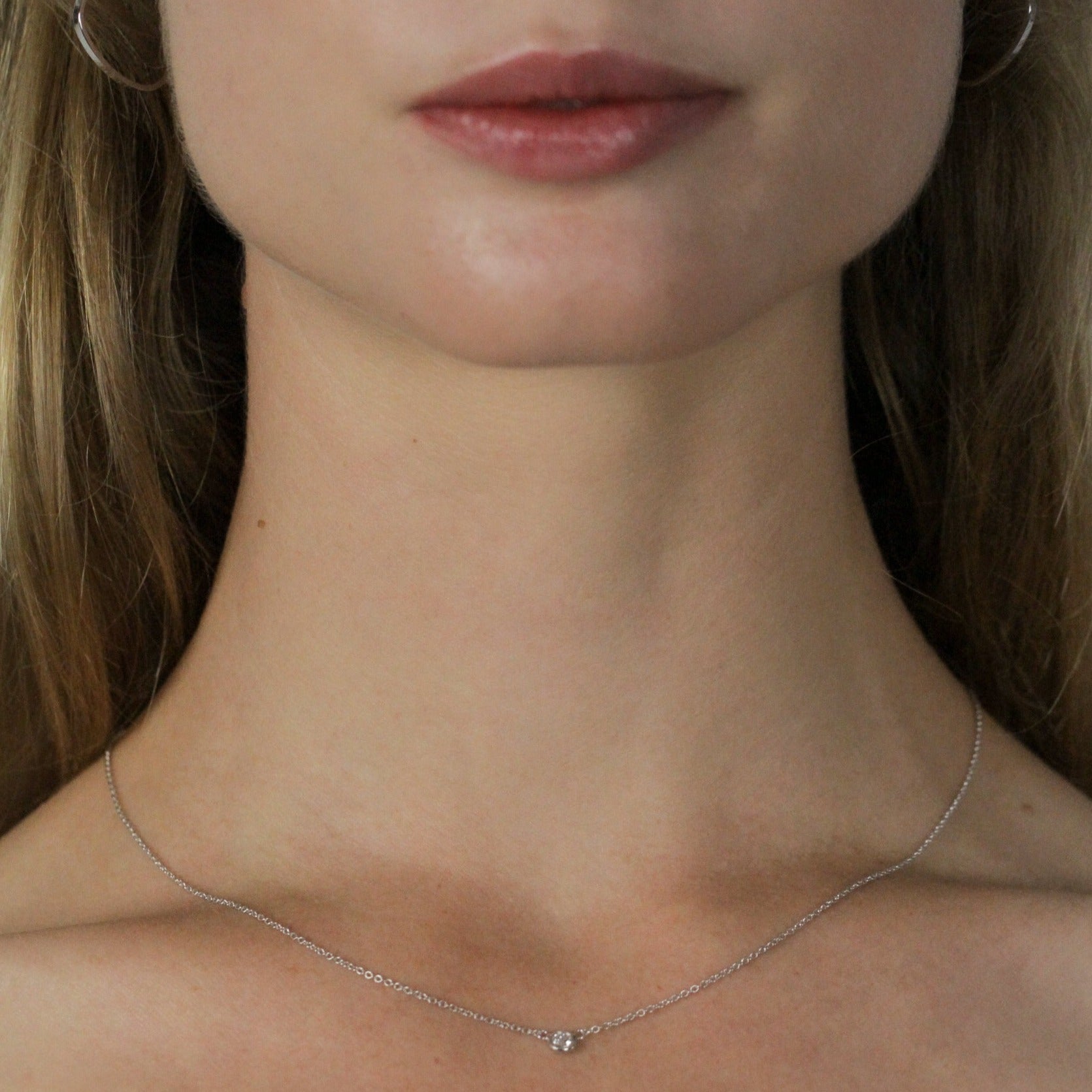white gold chain with diamond on model