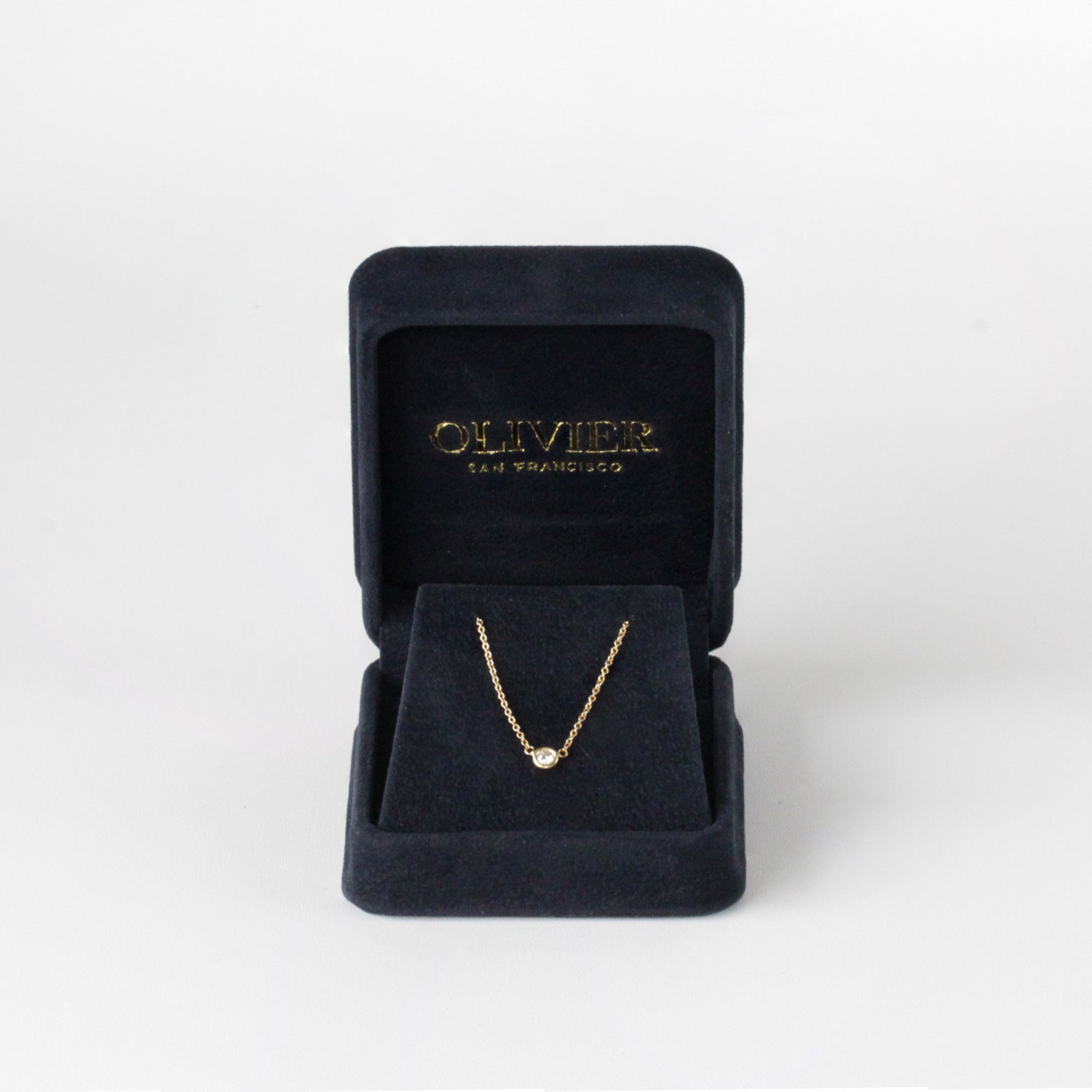 gold chain with diamond in box