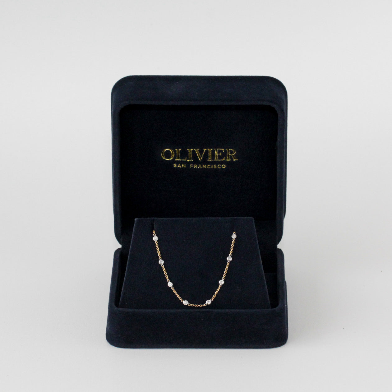 gold chain with diamonds in box