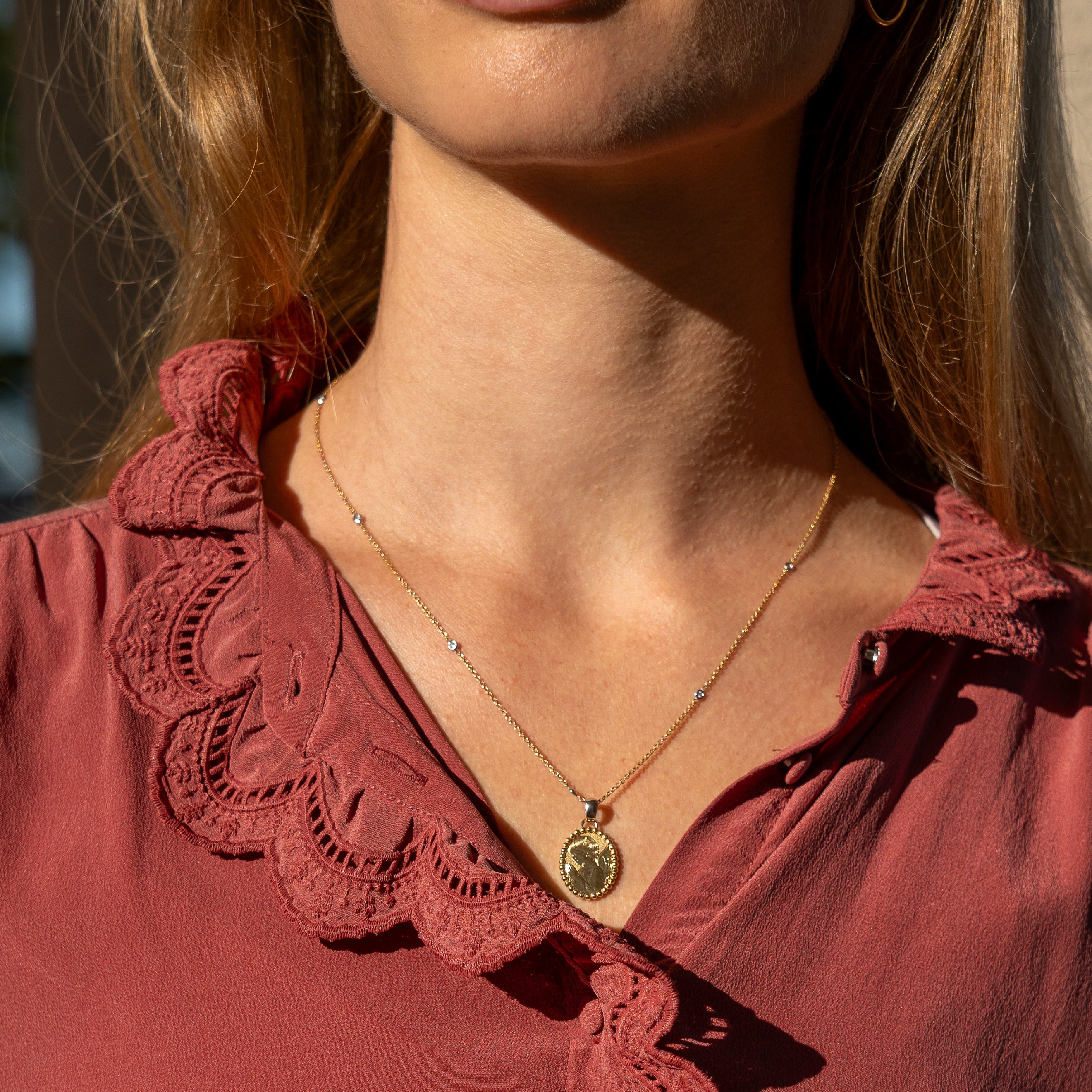 gold necklace with diamonds with pendant on model