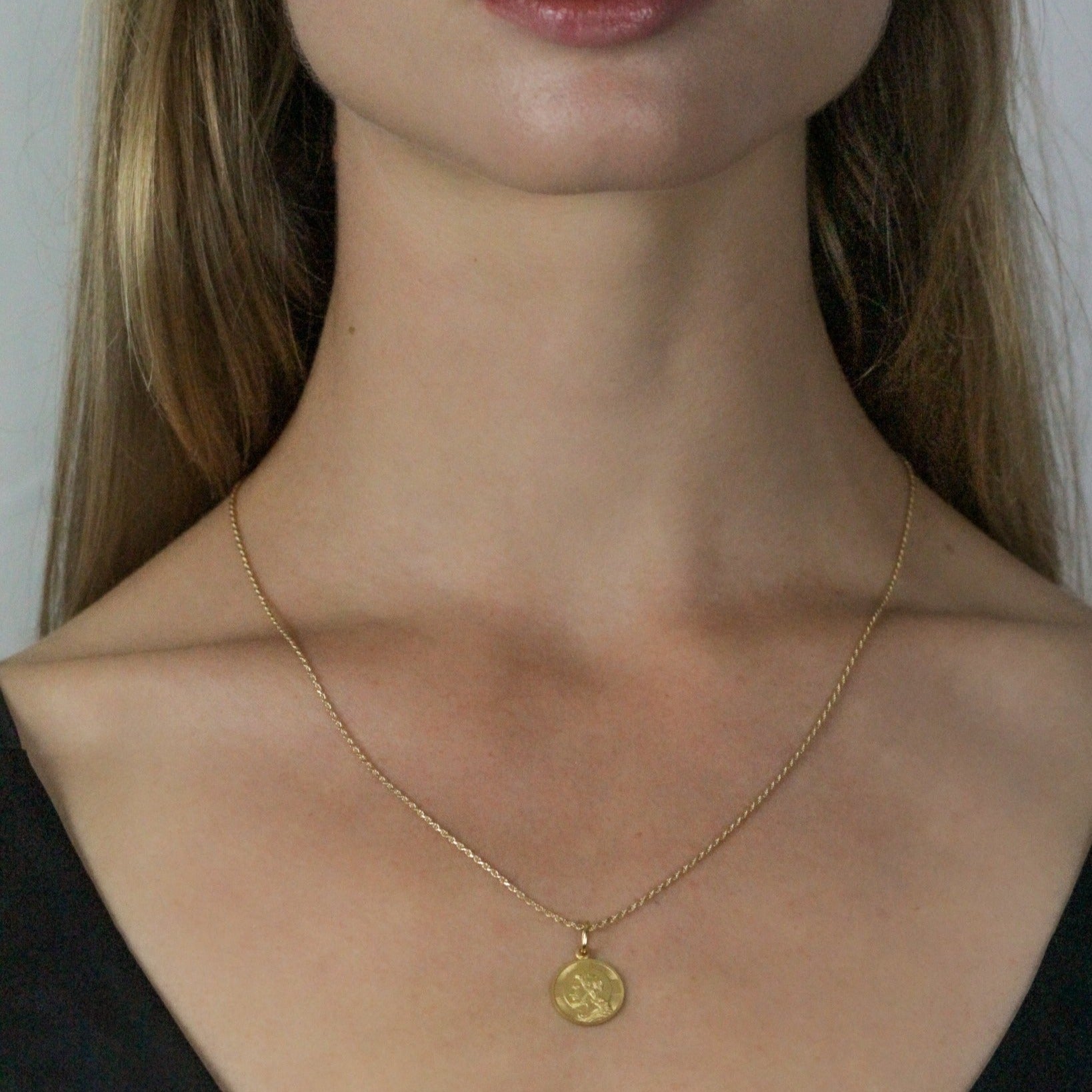 gold rope chain with pendant on model