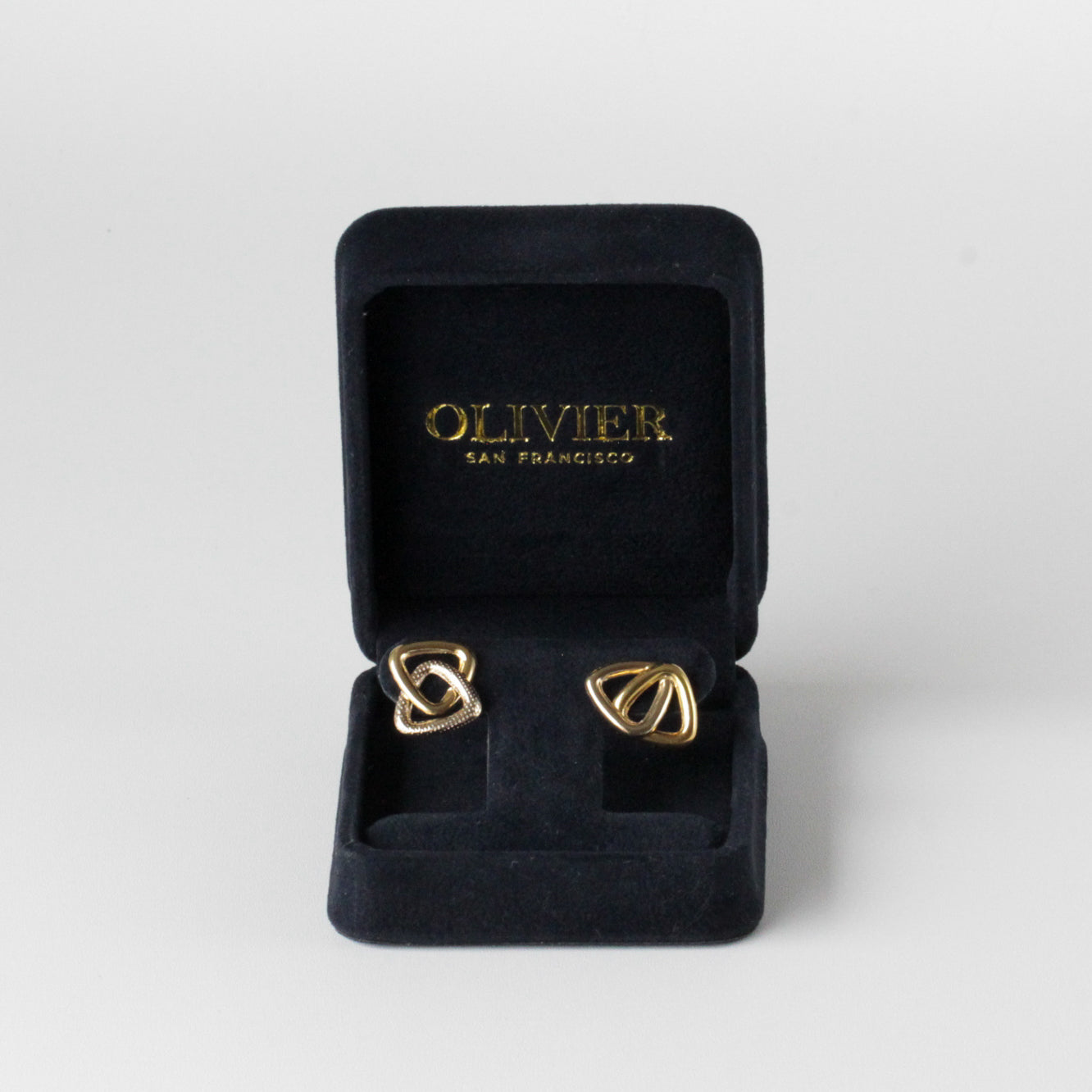 gold stud triangle earrings in box